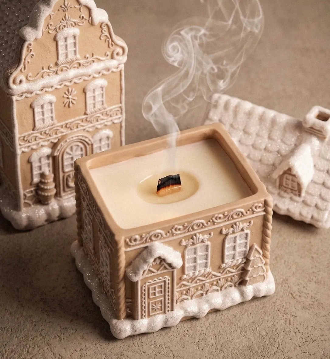 Gingerbread house-shaped candle with a wooden wick