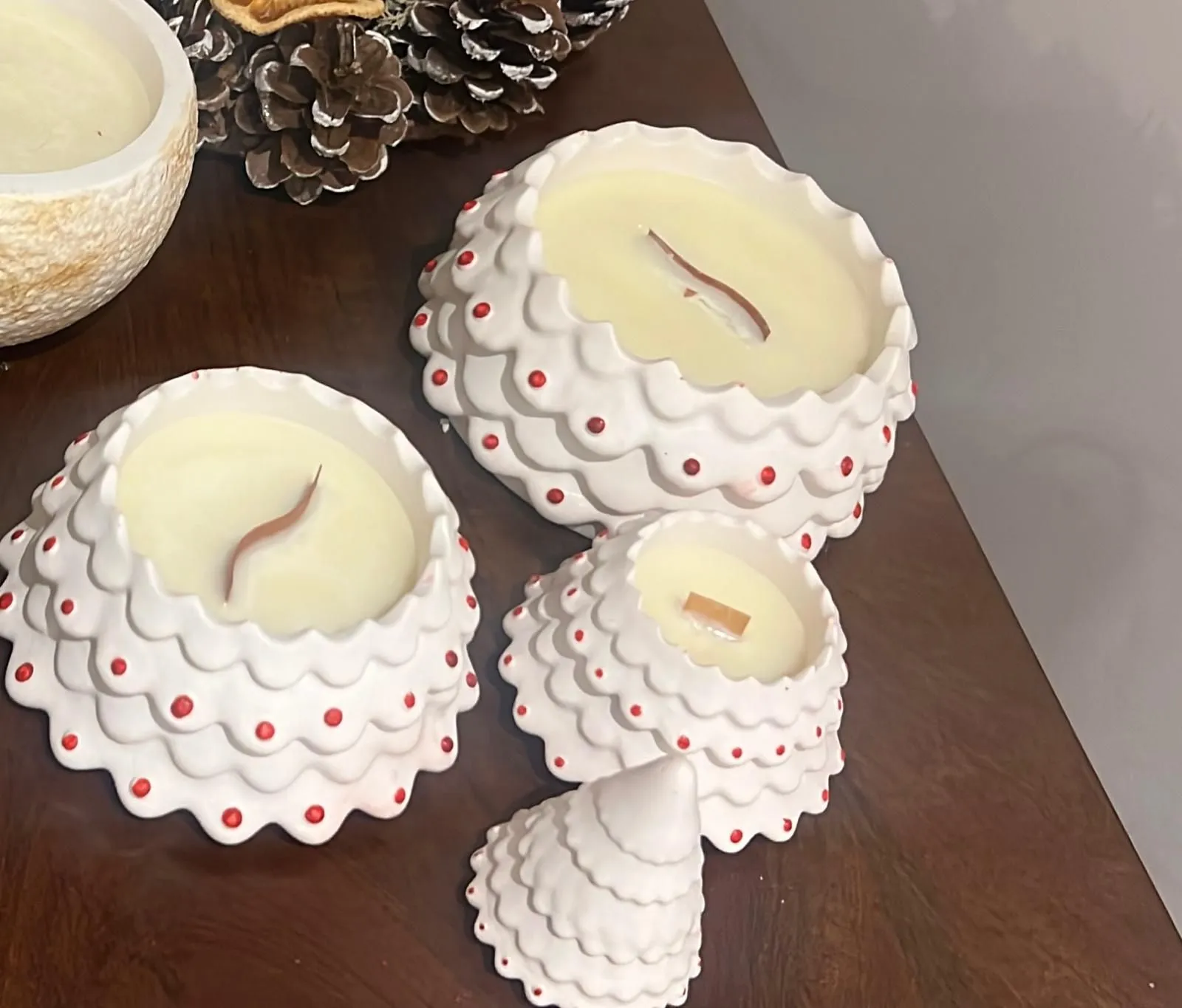 Sculpted white Christmas tree candles with red details