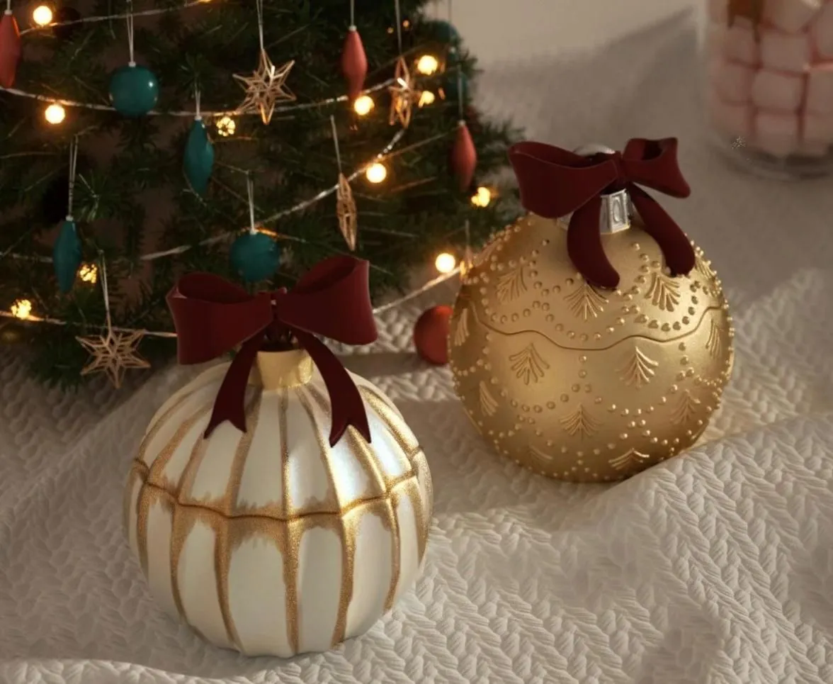 Ivory and gold ornament candle jars with burgundy bows